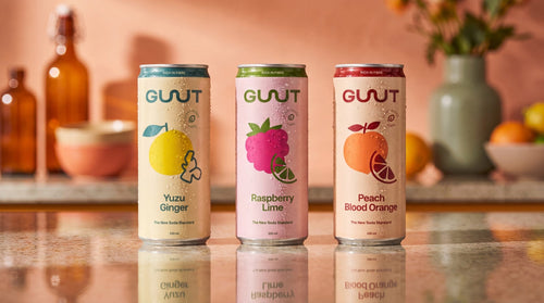 GUUTSy mixed prebiotic soda 24-pack product lineup showing three flavour cans lined up next to each other.