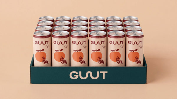 A multi-pack box of GUUT Peach Blood Orange prebiotic soda ready for shipping and low sugar refreshment.